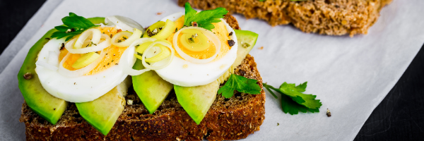 avocado and eggs on wheat toast