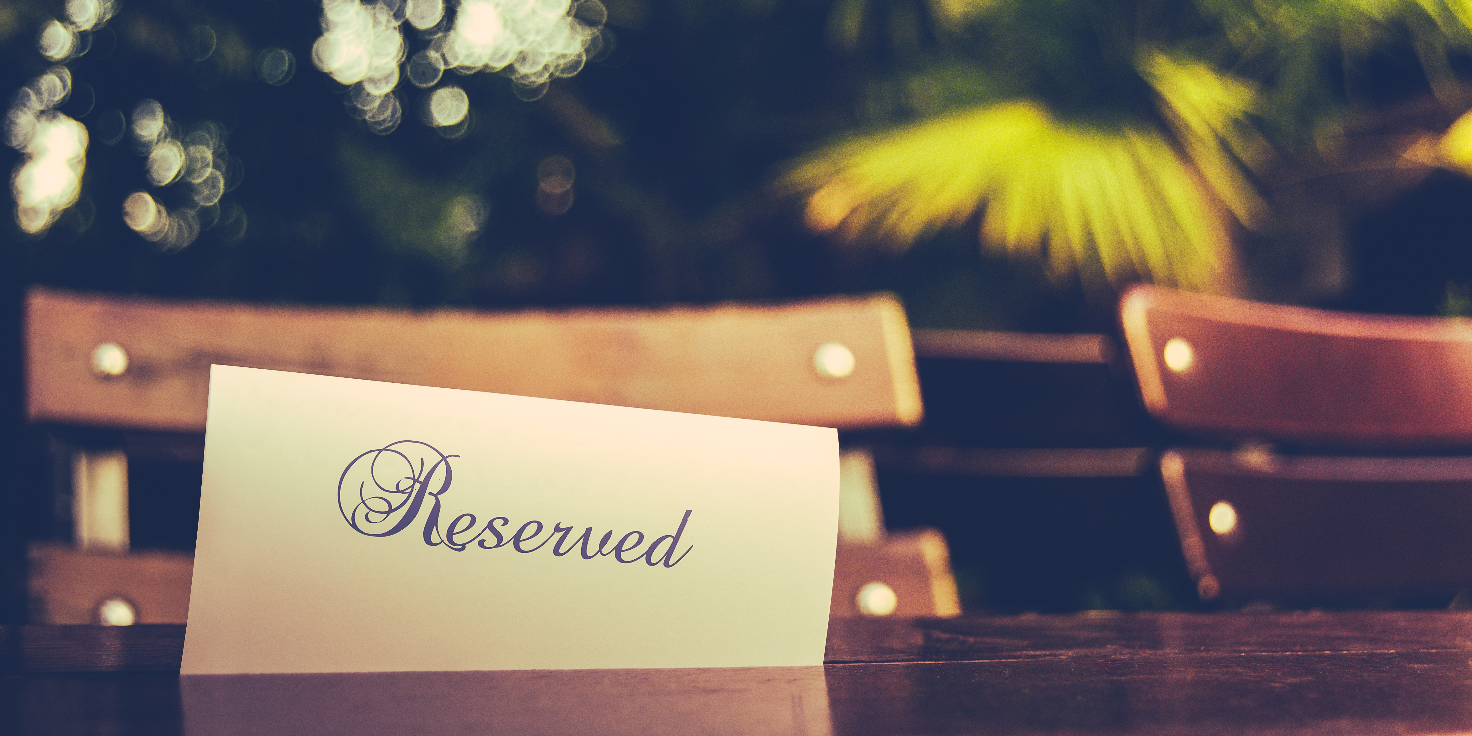 Reserved card outside on wooden table